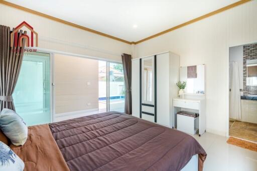 Bright and modern bedroom with direct access to a pool