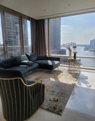 Modern living room with a view of the city and river