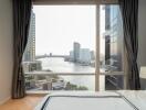 Bedroom with large window and river view