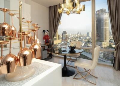 Modern dining area with large windows and city view