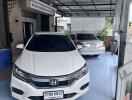 Covered garage with two parked cars