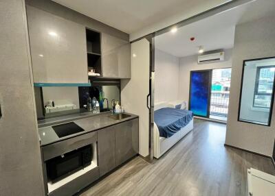 Modern studio apartment with kitchen and bedroom area