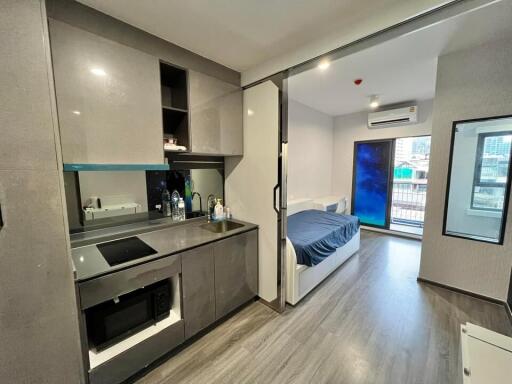 Modern studio apartment with kitchen and bedroom area