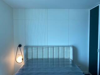 Minimalistic modern bedroom with bed and ambient lighting