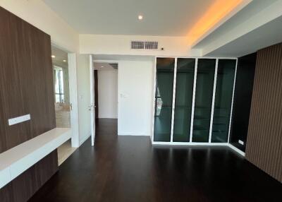 Modern bedroom with hardwood floors and built-in storage