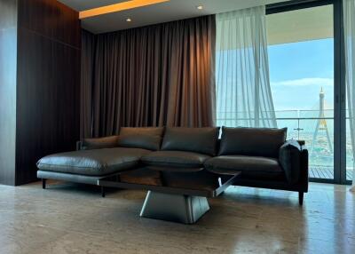 modern living room with black leather sofa and coffee table