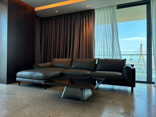 modern living room with black leather sofa and coffee table