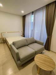 Bedroom with furniture and large window