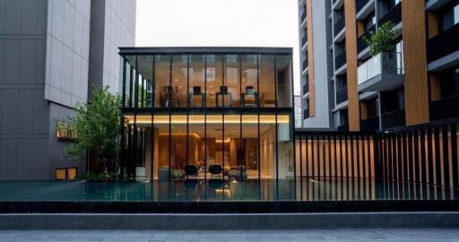 Modern building with glass facade and pool