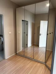 Bedroom with mirrored closets