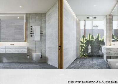Modern ensuite bathroom with large mirror and glass shower