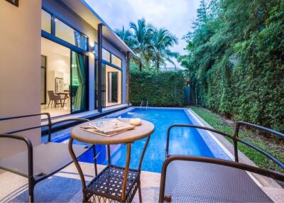 Outdoor seating area with pool view