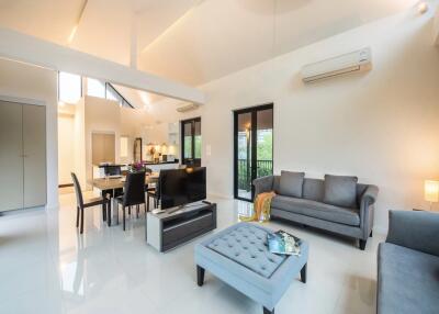 Spacious and modern living area with dining and kitchen view