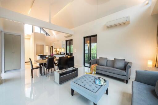 Spacious and modern living area with dining and kitchen view