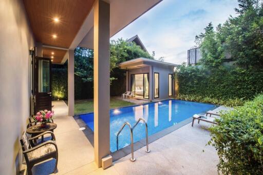 Luxurious outdoor area with swimming pool and modern house