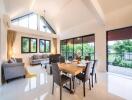 Spacious living and dining area with high ceiling and large windows