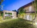 Modern house exterior with carport and garden