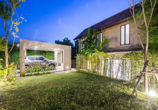 Modern house exterior with carport and garden