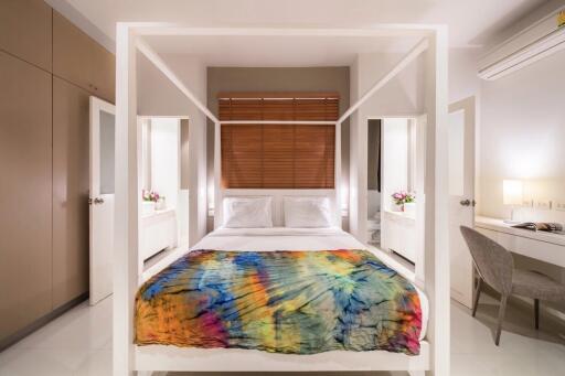 Modern bedroom with vibrant bed cover