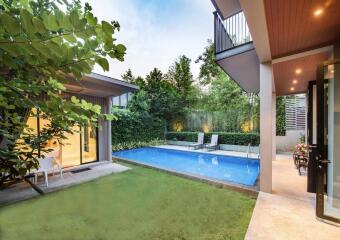 Modern backyard with pool and greenery