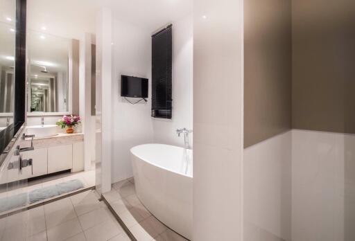 Modern bathroom with a bathtub and vanity