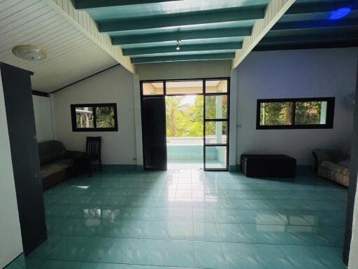 Spacious living room with pool view