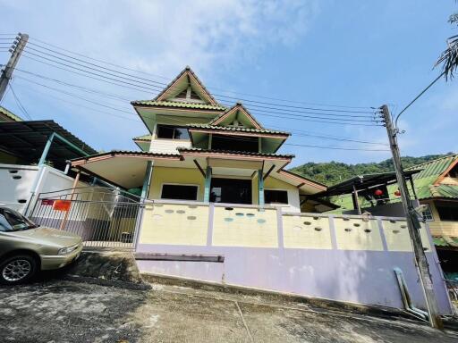 Two-story house with a unique roof design