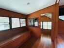 Main living area with large windows and wooden interior