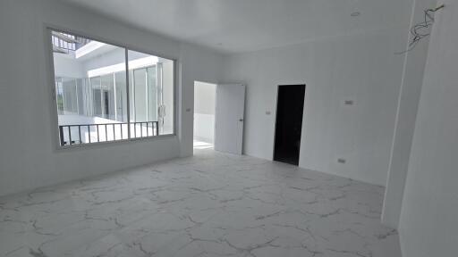 Unfurnished room with large windows and marble floor