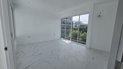 Bright bedroom with large window