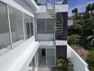 Outdoor area with pool and spiral staircase