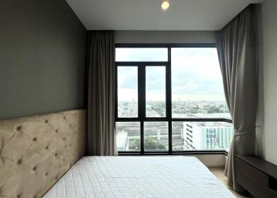 Modern bedroom with large window view