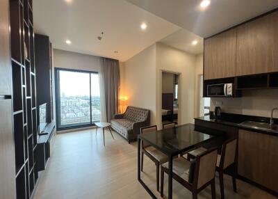 Modern living area with wooden furniture and large window