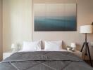 Modern bedroom with a double bed, contemporary wall art, and bedside lamps