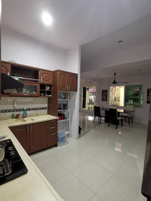 Modern kitchen with open layout leading to dining area