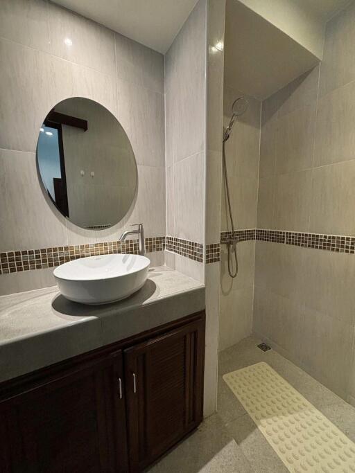 Modern bathroom with vanity and shower area