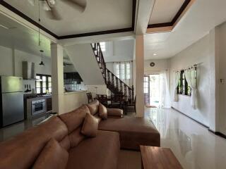 spacious living room with kitchen and dining area