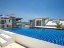 Outdoor view of a private swimming pool on a rooftop with surrounding buildings