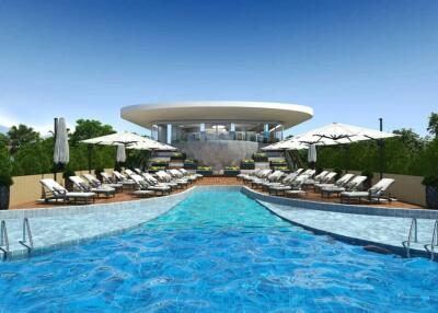 Luxurious outdoor swimming pool area with sun loungers and umbrellas