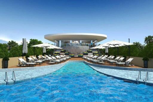 Luxurious outdoor swimming pool area with sun loungers and umbrellas