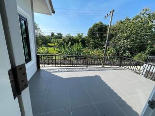 Spacious balcony with tiled flooring and scenic view