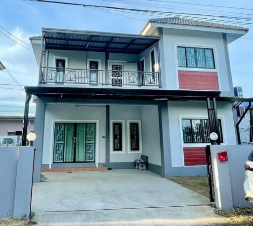 Two-story house with balcony and modern design