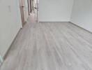 Spacious empty room with wooden flooring