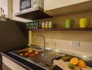 Modern kitchen with fruit and appliances