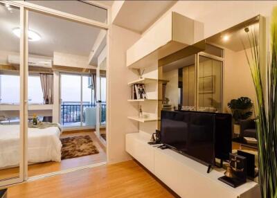 Modern living area with adjacent bedroom