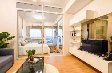 Modern living room with adjoining bedroom