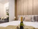 Luxurious bedroom with champagne bottle and plush fur throw on the bed