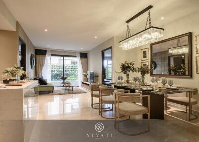 Spacious and elegantly decorated living room with dining area, large windows, and contemporary furnishings.