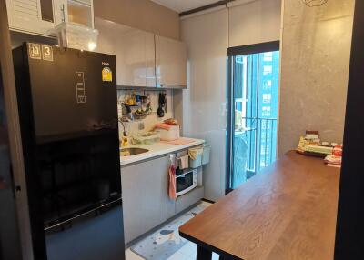 Modern kitchen with sleek appliances and a dining table