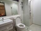 Modern bathroom with glass shower enclosure and vanity